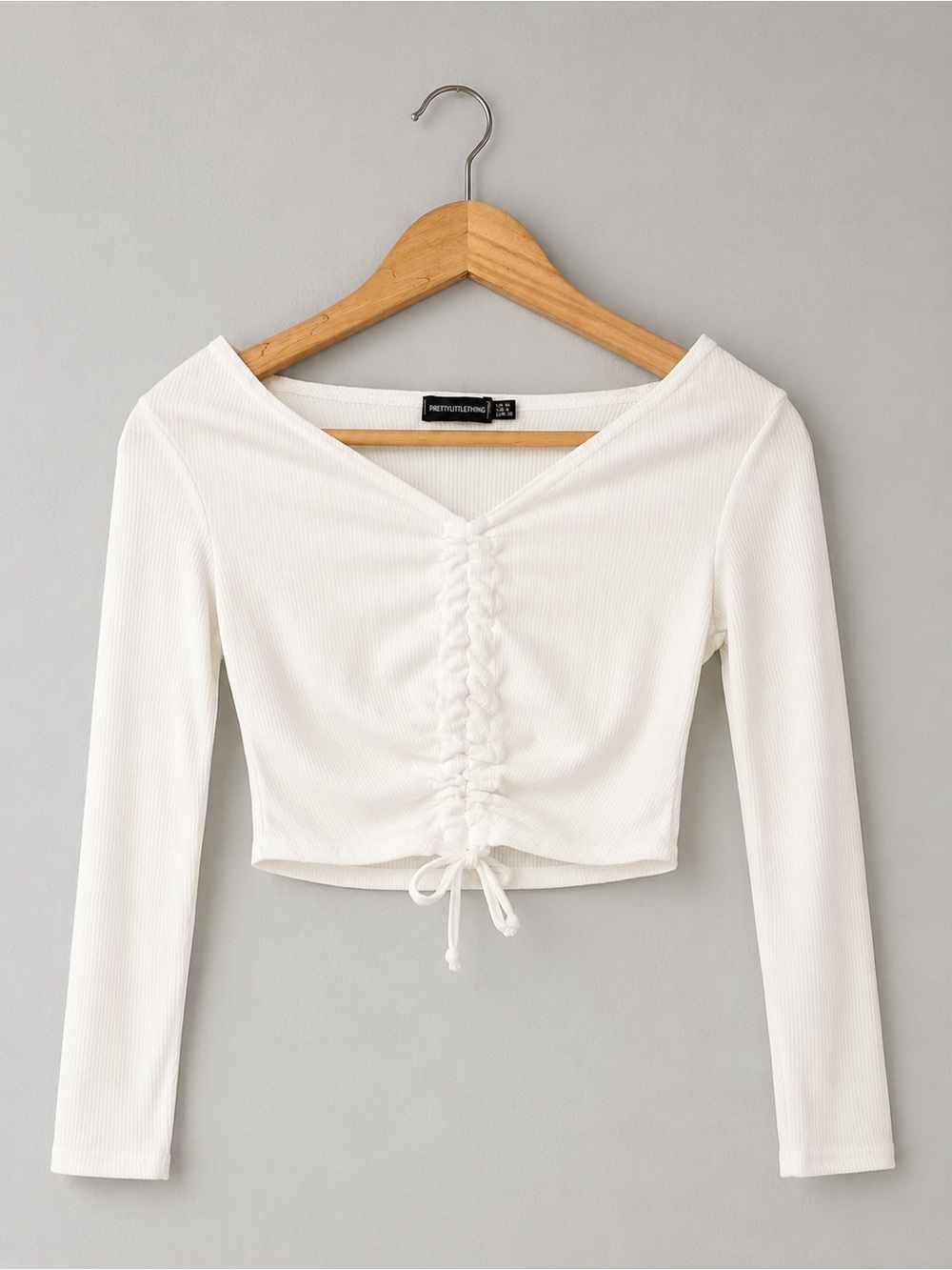PrettyLittleThing White Ribbed Ruched V-Neck Long Sleeve Crop Top